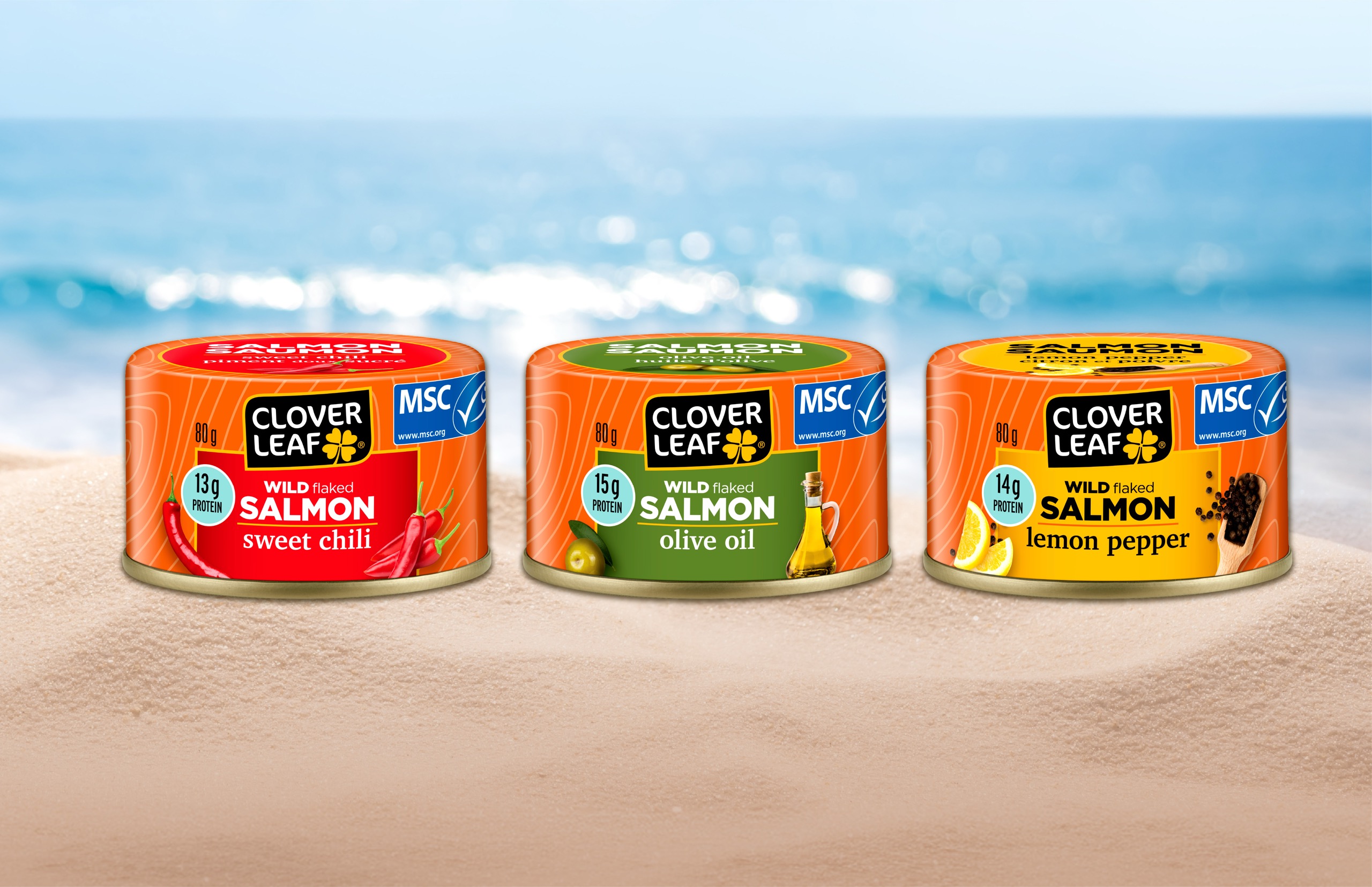 Clover Leaf Flavored Salmon cans on a beach