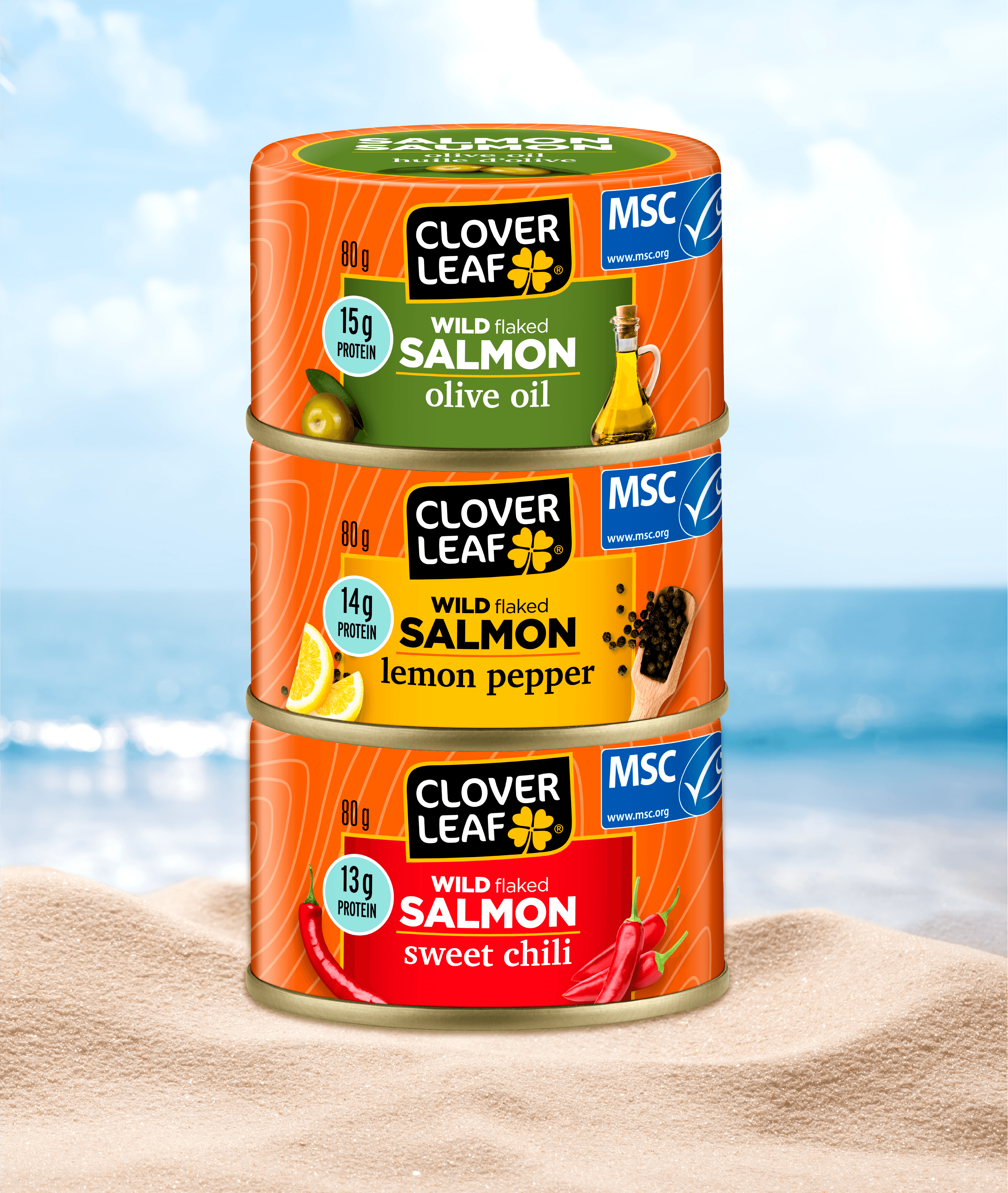 Clover Leaf Flavored Salmon range stacked on a beach