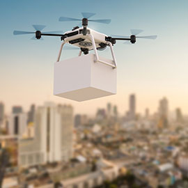 Drone in metropolitan city with package