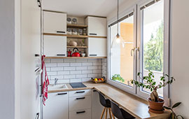 small kitchen with white cupboards