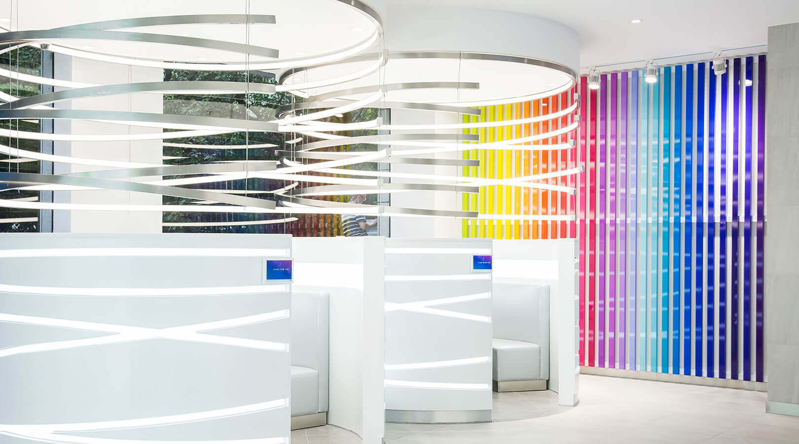 nu skin interior of store with sitting pods and colourful wall