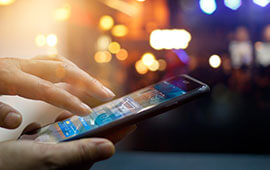 Mobile phone being checked by someone outside in a city