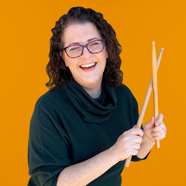 Ellen Evered holding drumsticks