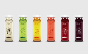 various juices on display on a grey background