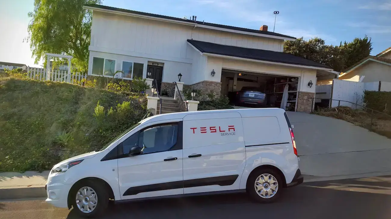Tesla Service Ranger van parked at a customers house
