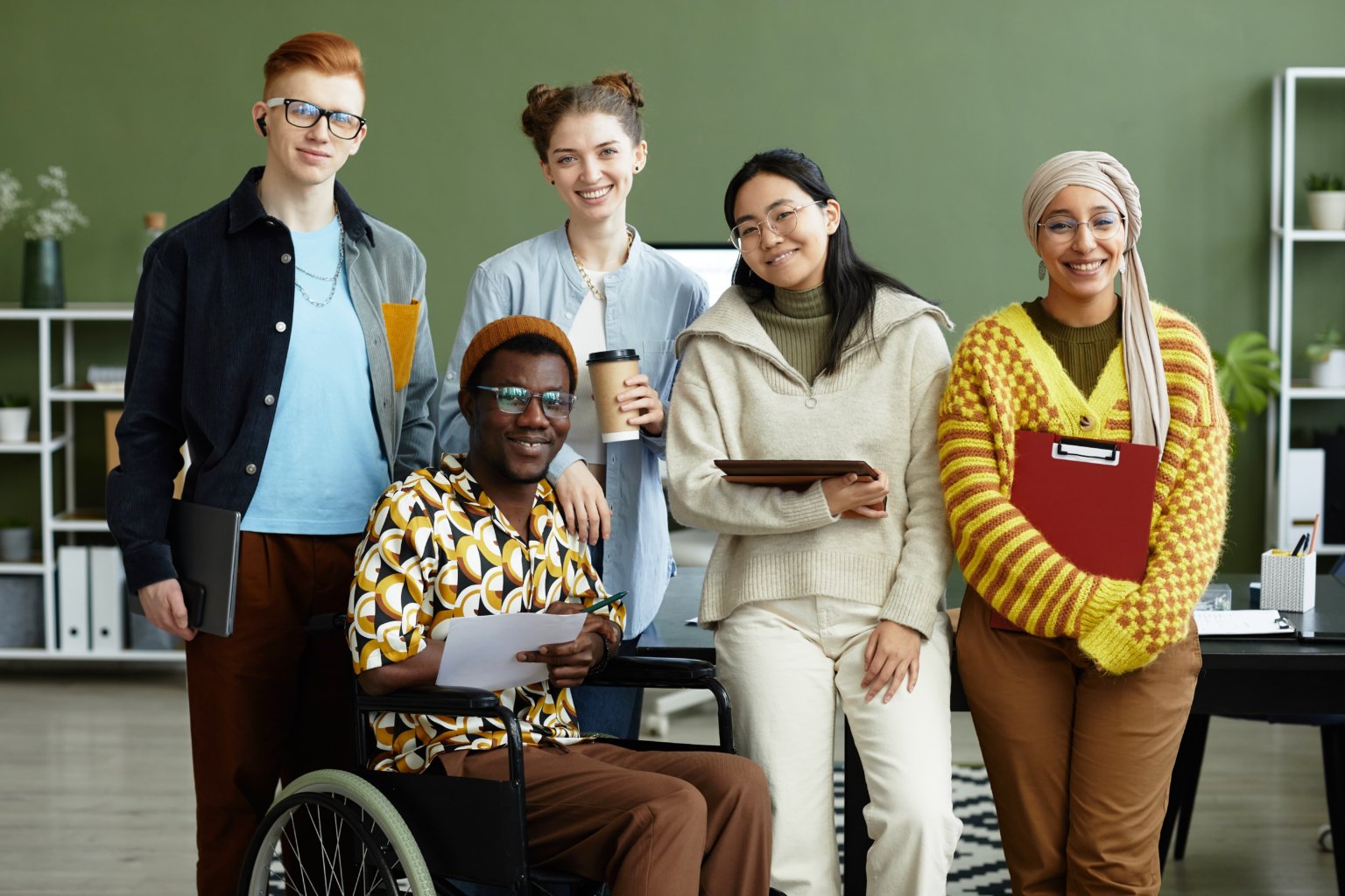 Diverse group of people featuring people of colour, disabled, etc.